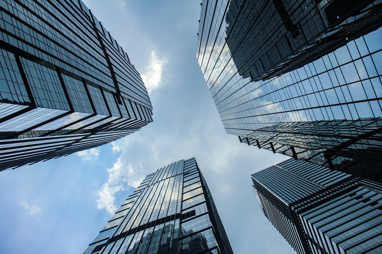 A striking view of futuristic skyscrapers in Jakarta, Indonesia, from ground level.
